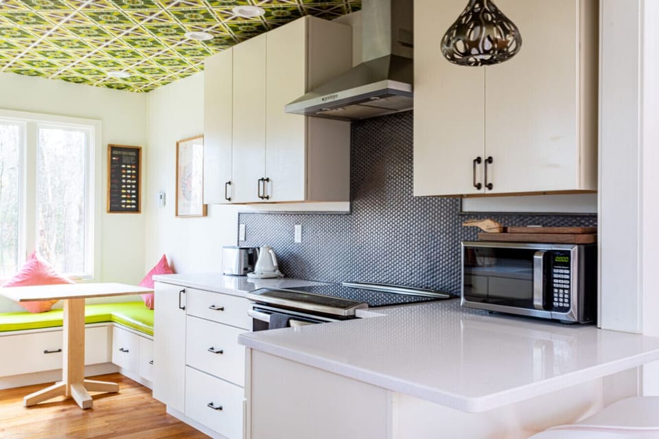 Kitchen includes stainless steel appliances and breakfast nook