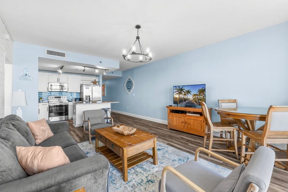 A charming second bedroom with coastal decor and a king-sized bed for a restful night`s sleep