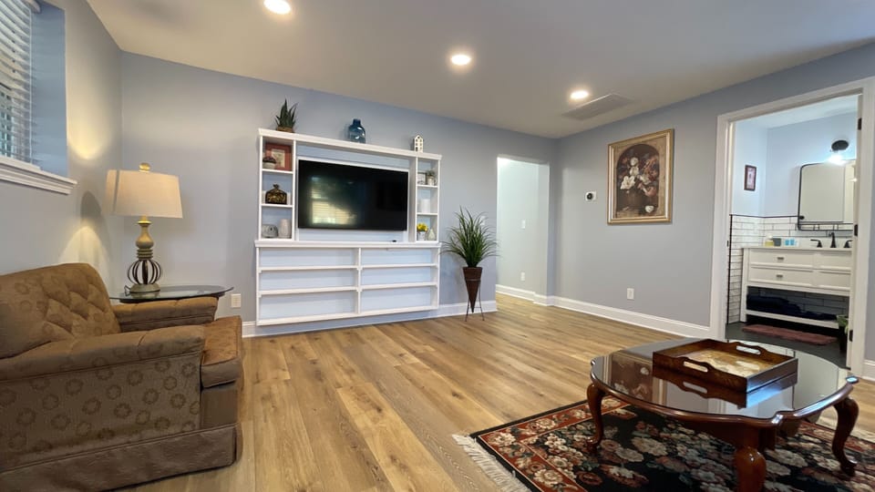 Relax in this stylish living room with a comfy sofa, Smart TV, modern design, and fast WiFi for all your entertainment needs!