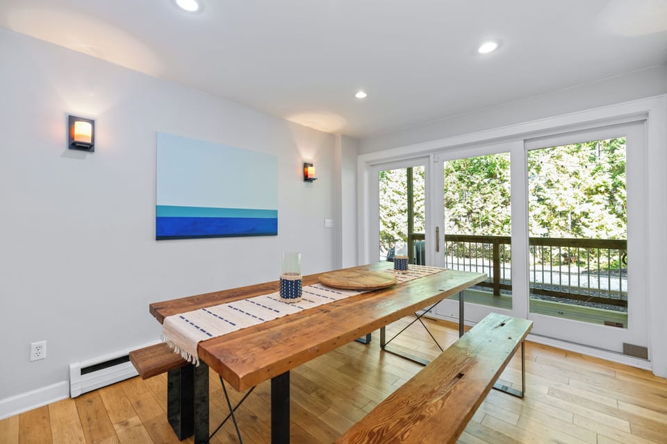Large wooden dining table just off the kitchen
