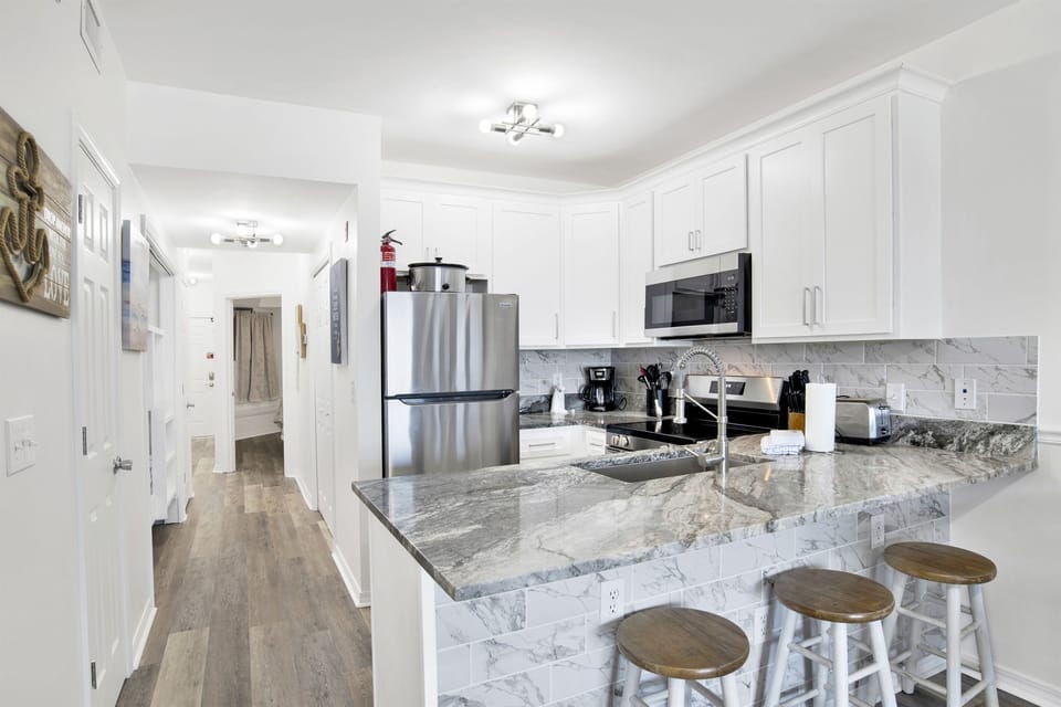 Bar seating for 3 and kitchen view