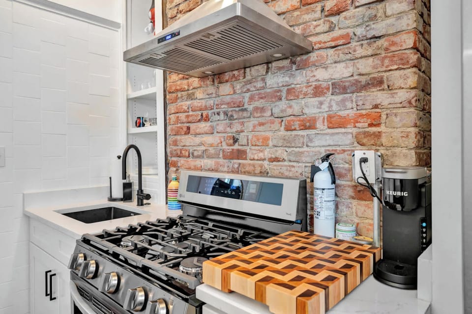 Kitchen: Modern stove with a sleek design, offering precision cooking and blending seamlessly into the kitchen's aesthetic.