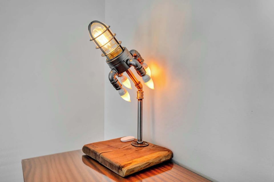 First unit - Whimsical rocket ship lamp, adding a fun and playful touch to the room while providing soft, ambient lighting.