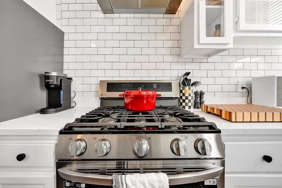 First unit - Modern stove with a sleek design, offering precision cooking and blending seamlessly into the kitchen's aesthetic.