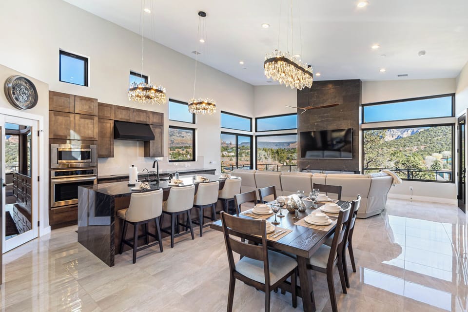 Dining table with seating for six (6) and seating for four (4) at the kitchen island.