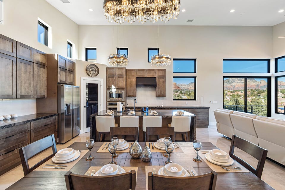 Kitchen features a wall oven and a large island with bar seating for four.