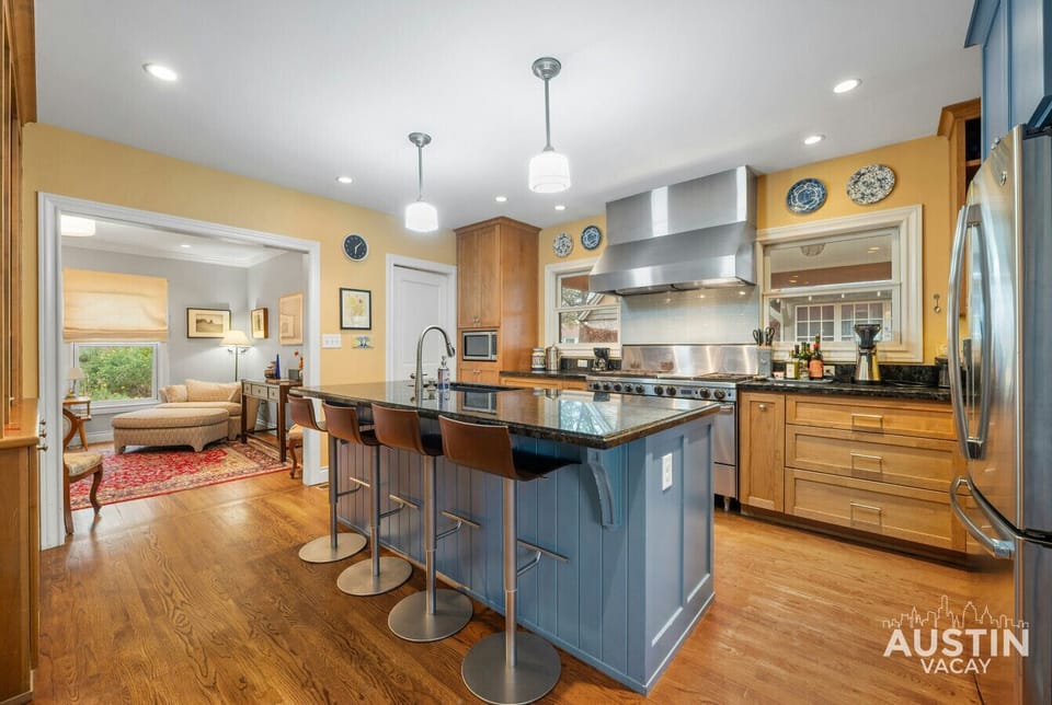 Cook up a feast or grab a seat! This spacious kitchen is fully equipped for your culinary adventures, with a comfy lounge area nearby for when you just want to kick back.