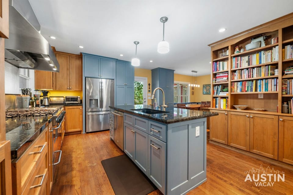 Prep with ease on the spacious island and enjoy the convenience of stainless steel appliances. Bonus: direct access to the dining area for seamless meals!