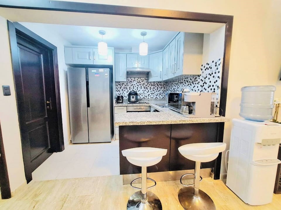 Deluxe Condo, 2 Bedrooms, Golf View | Private kitchen | Full-size fridge, microwave, oven, stovetop