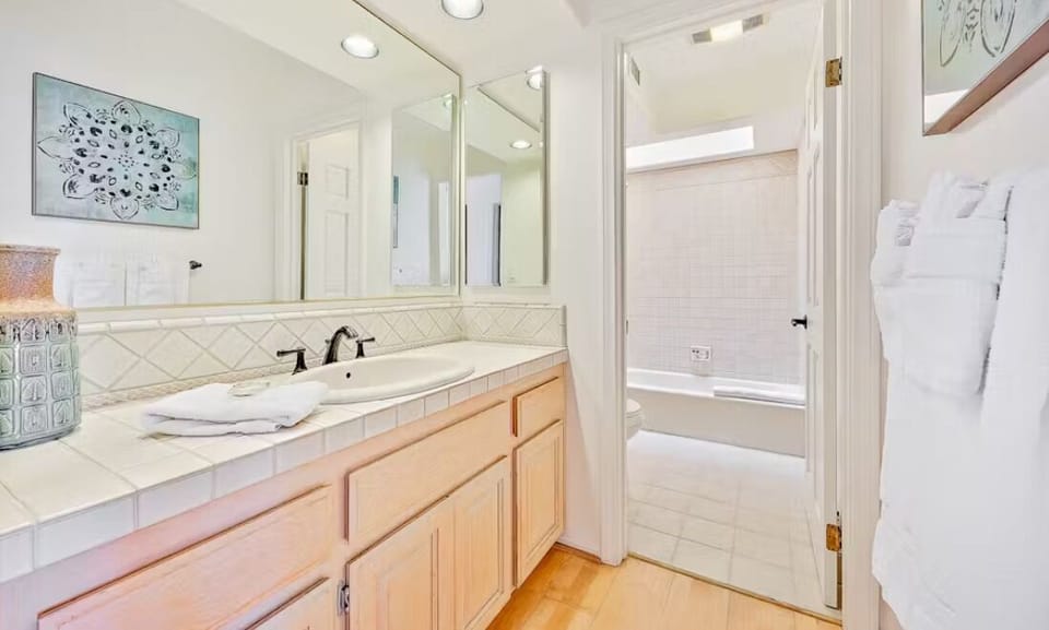 En suite bathroom, bedroom with 2 king beds