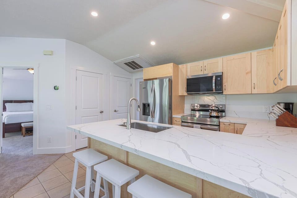Open kitchen featuring a breakfast bar, good for 4.