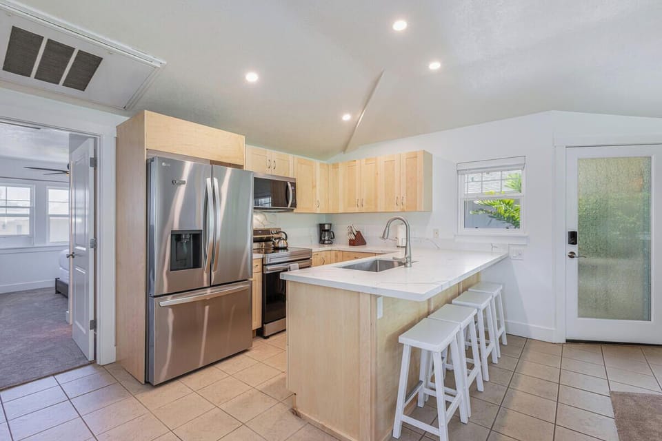Modern kitchen with a spacious island and seating for 4.