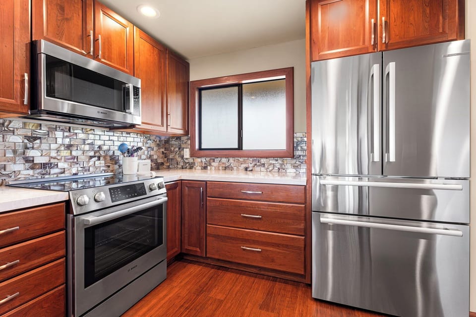 Another angle of the kitchen showcasing a sleek design.