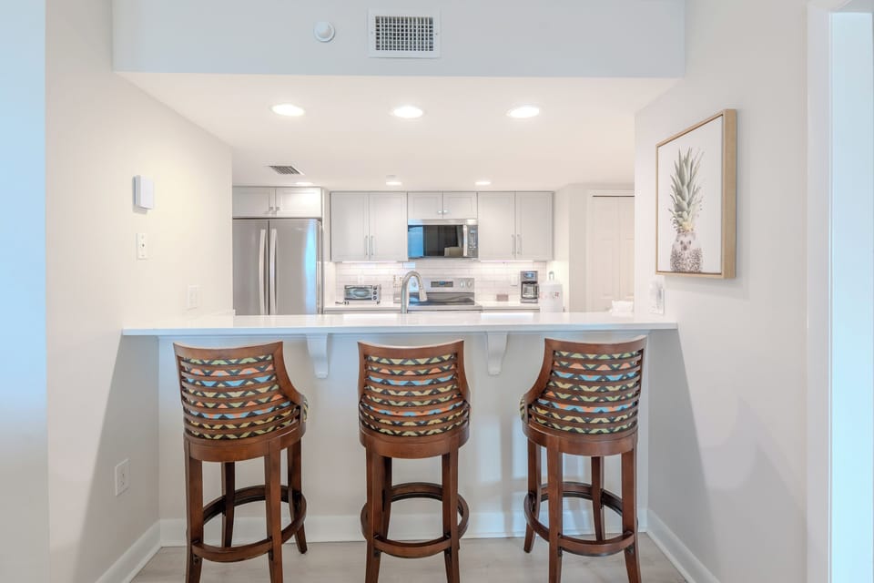 Bar facing kitchen- Watch your chef prep your meals!