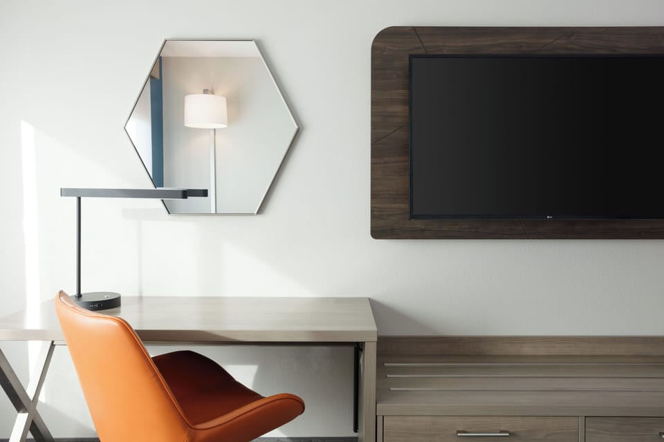 Desk, laptop workspace, blackout drapes, iron/ironing board