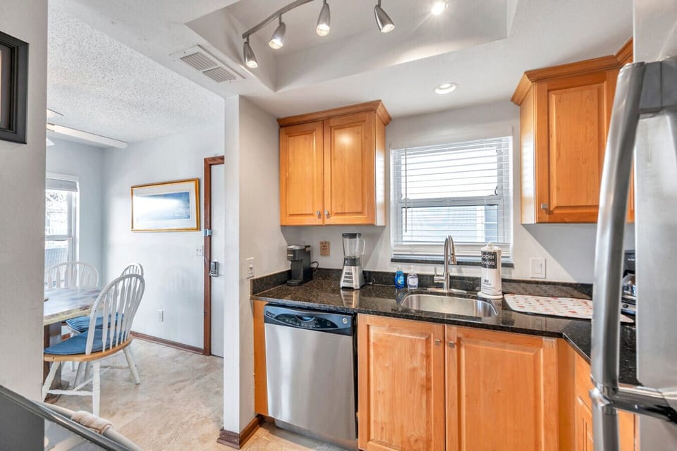 Functional kitchen w/ wood cabinetry, ample counters & everything needed for easy cooking.