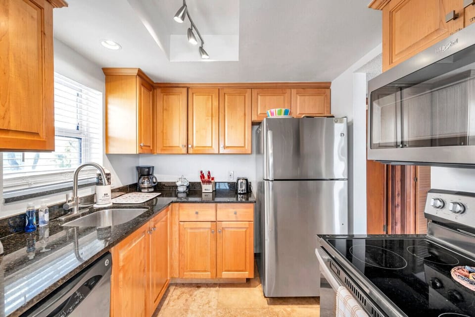 Well-equipped kitchen w/ ample counter space & stainless appliances for easy home cooking.