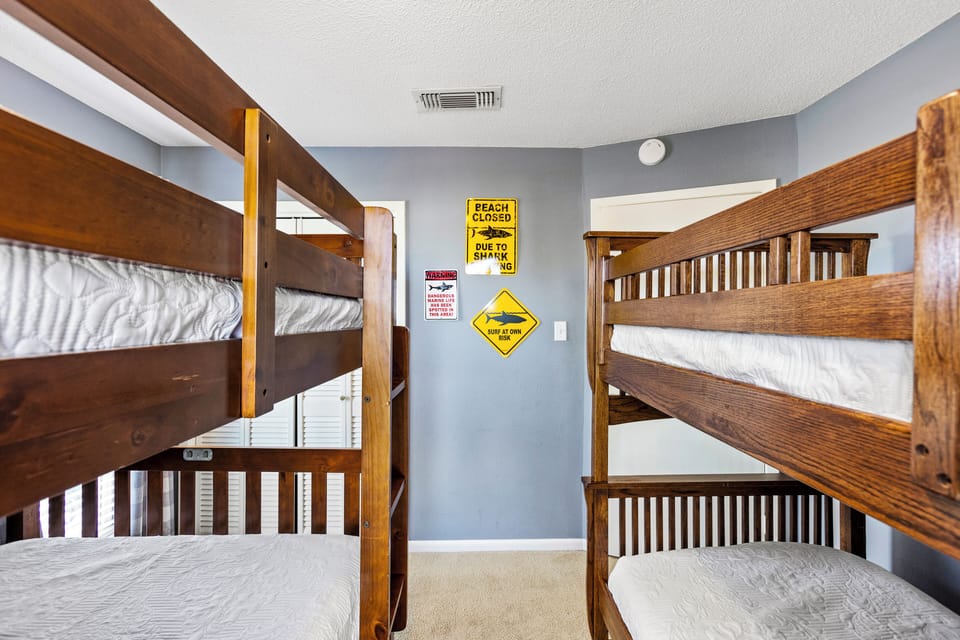 Bedroom 2 features two bunkbeds and a closet.