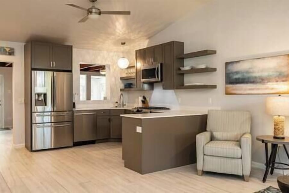 The kitchen and living room are open and airy.
