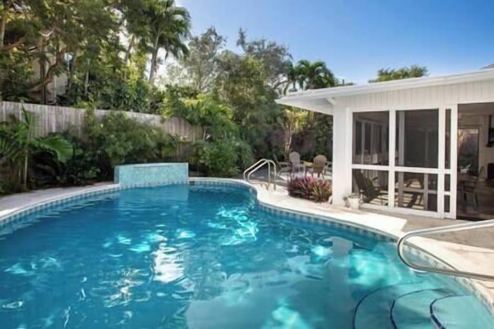Easy access into the private and heated concrete pool.