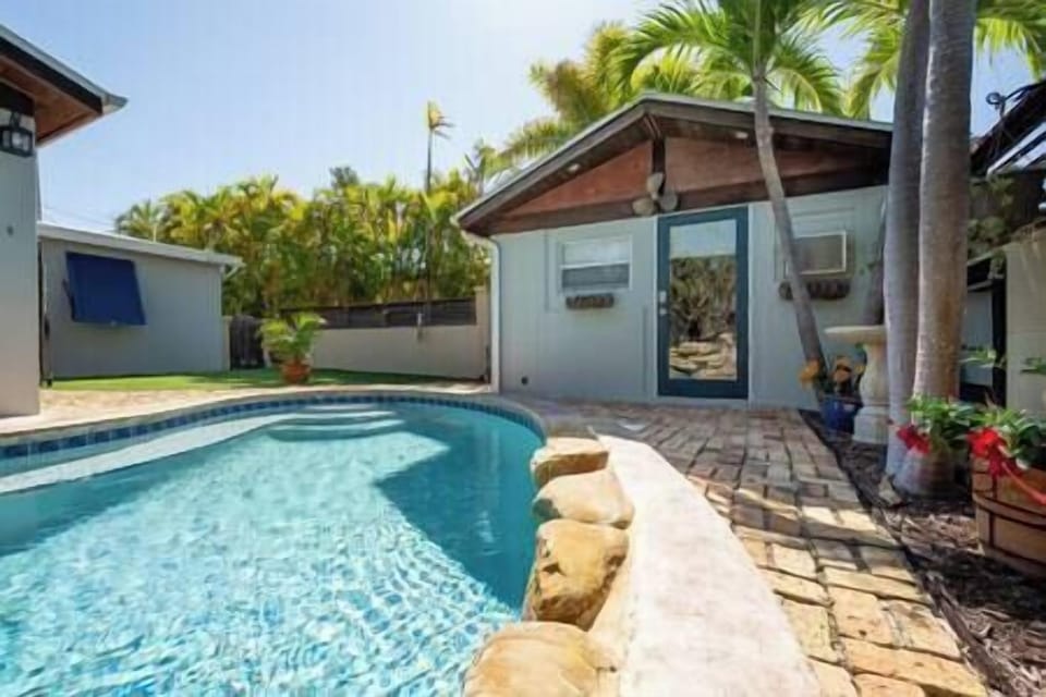 The casita or guest cottage is a private guest bedroom with half bath next to the pool.