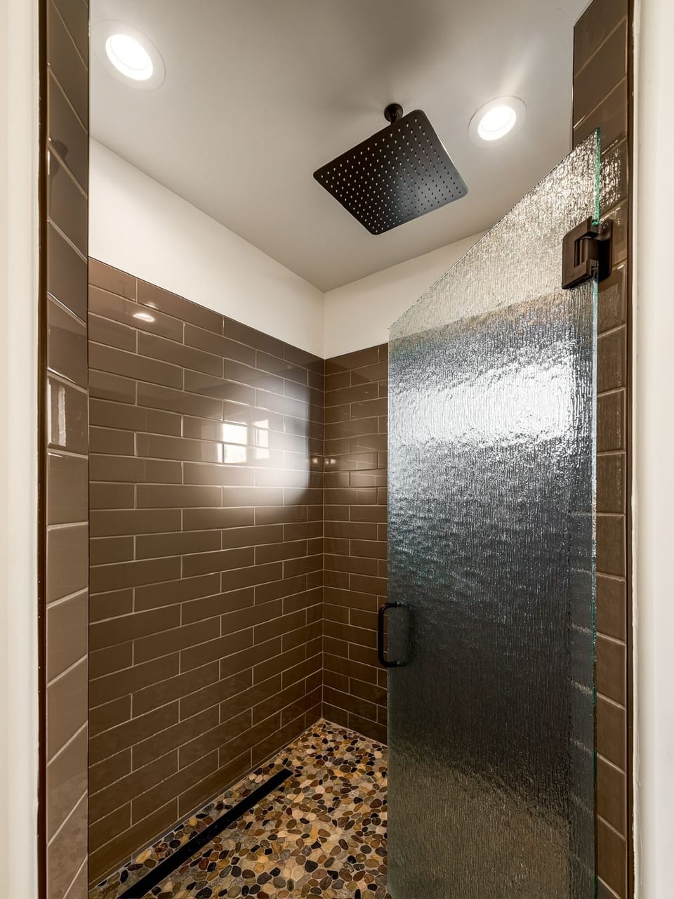 Rainfall shower with in-shower bench in Master bath