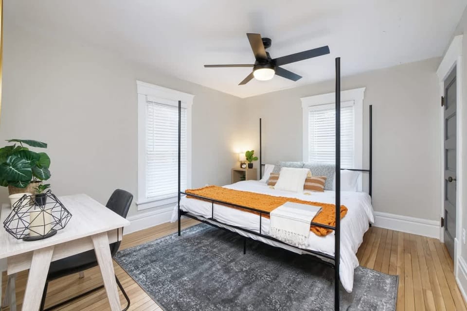 Bedroom w/ bed, clean lines & soft lighting for a calm, restful retreat