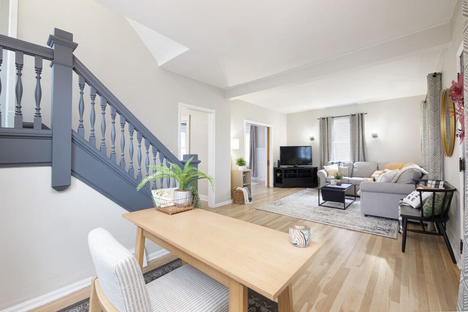 A cozy haven, perfect for a productive day.  Sunshine streams in, illuminating the warm wood floors. ✨ #HomeSweetHome