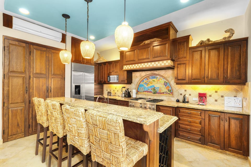 Fully Equipped Kitchen. 
Island / AC next to living room.