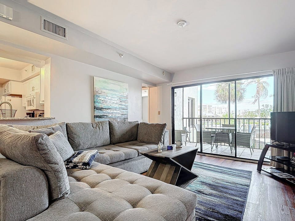 Living room opens to balcony with water view