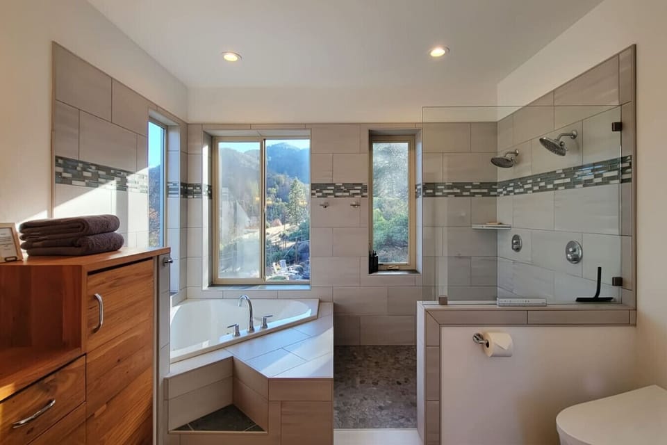 jacuzzi bath tub, dual shower head walk in shower, heated floors