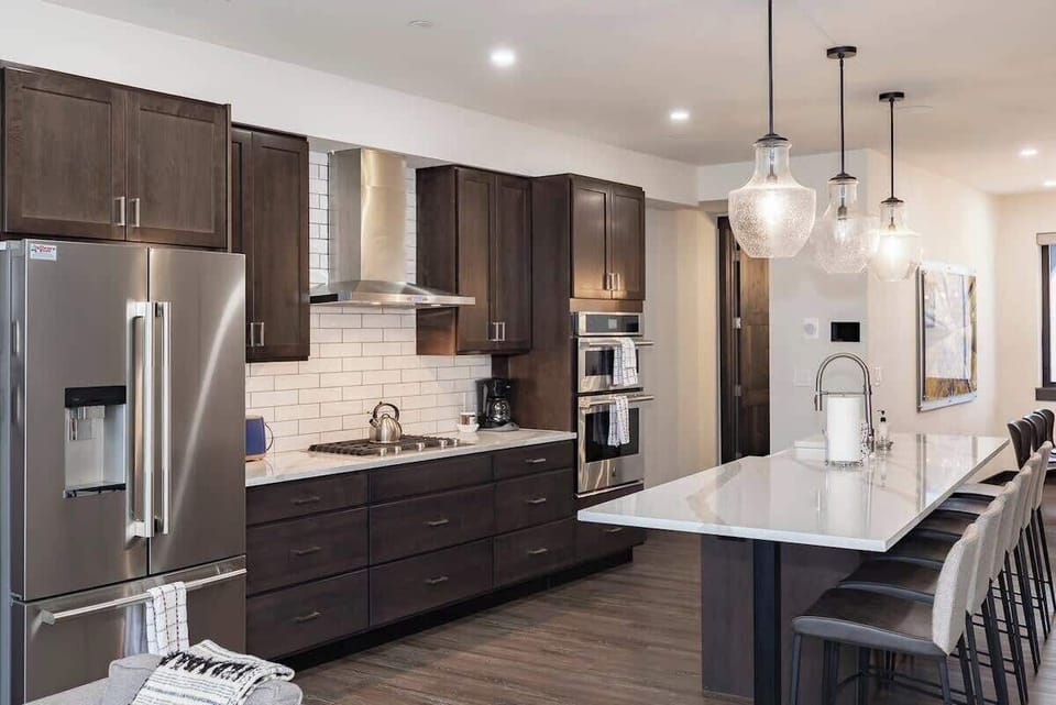- Fully stocked kitchen with subway tile, essential appliances, and thoughtful touches
- Long island offers space for casual meals, drinks, and conversation
- Bright, inviting layout perfect for entertaining or quiet mornings

