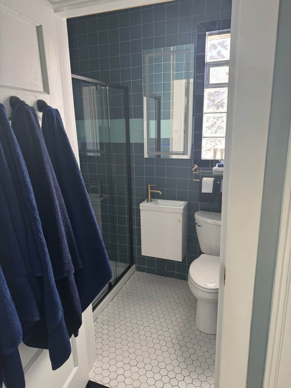 Bathroom with renovated walk-in shower