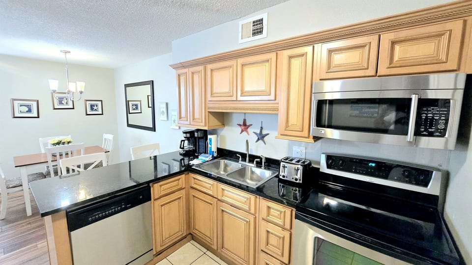 Well  equipped kitchen with granite countertops
