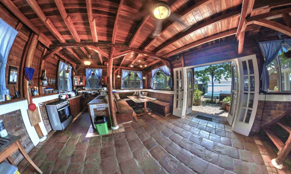 Fully stocked Kitchen with dining room Seating and beautiful views over the front yard and ocean.  