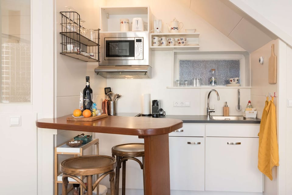 Stylish, fully equipped kitchenette with modern appliances and thoughtful touches for a comfortable stay.