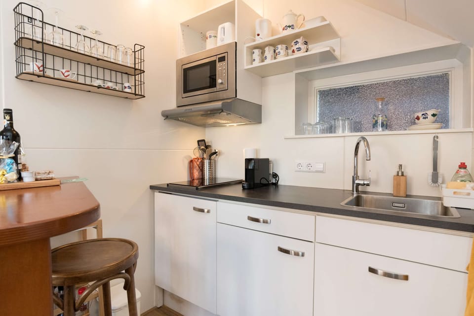 Stylish, fully equipped kitchenette with modern appliances and thoughtful touches for a comfortable stay.