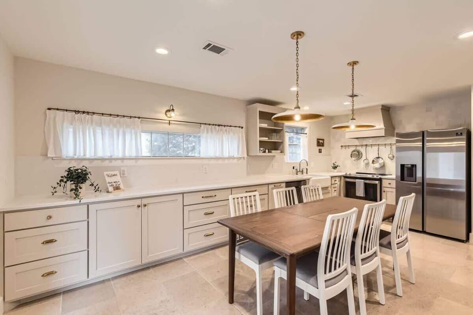 Cozy dining space with a farmhouse-style table and bench seating for a relaxed vibe.