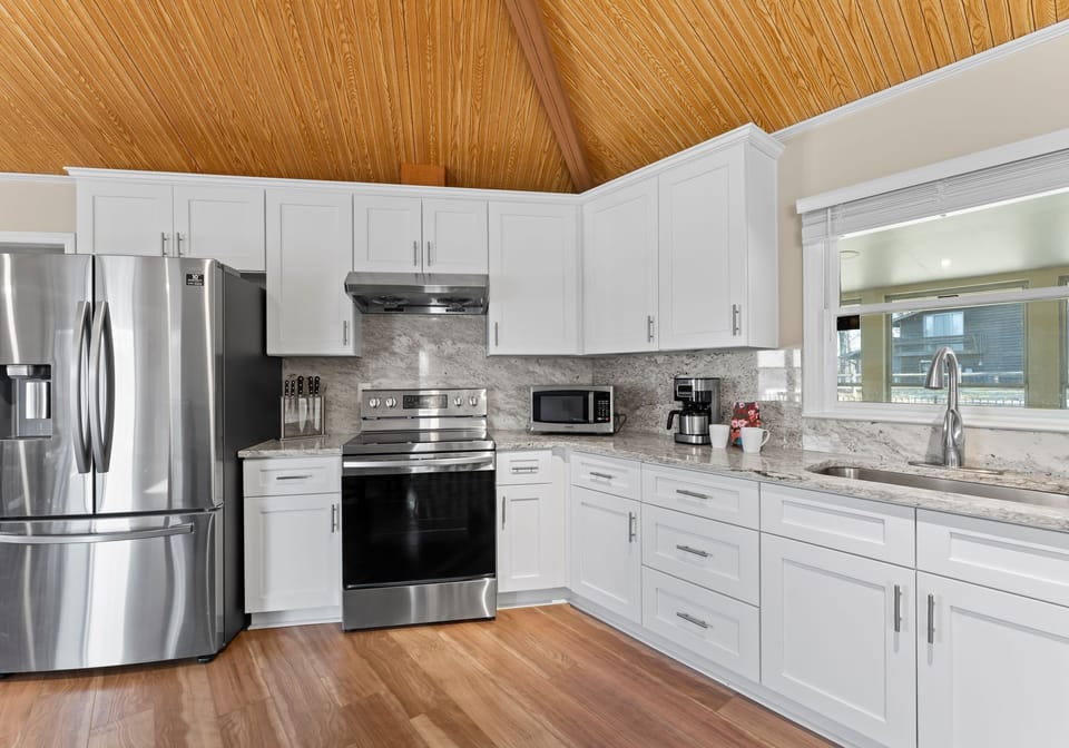 Fully stocked kitchen with new counter tops & appliances. 