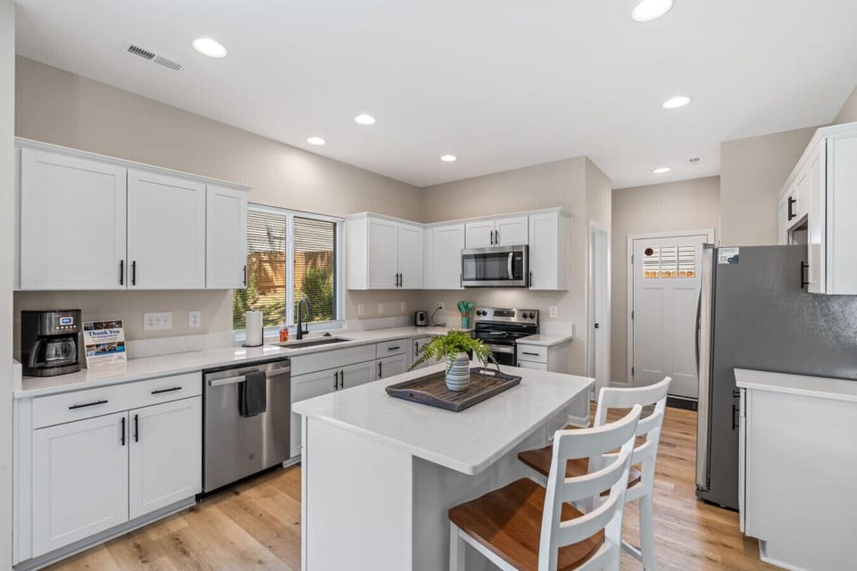 Full kitchen with island to prepare and enjoy meals.