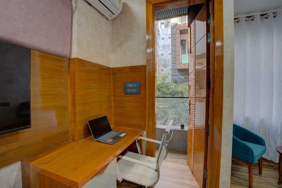 Deluxe Apartment | Living area | 32-inch LCD TV with digital channels
