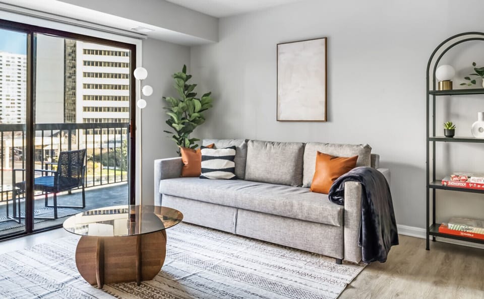 Imagine unwinding here after a busy day of sightseeing. You can kick back on the comfy sofa, turn on the TV, and enjoy some quiet time in this welcoming living room.