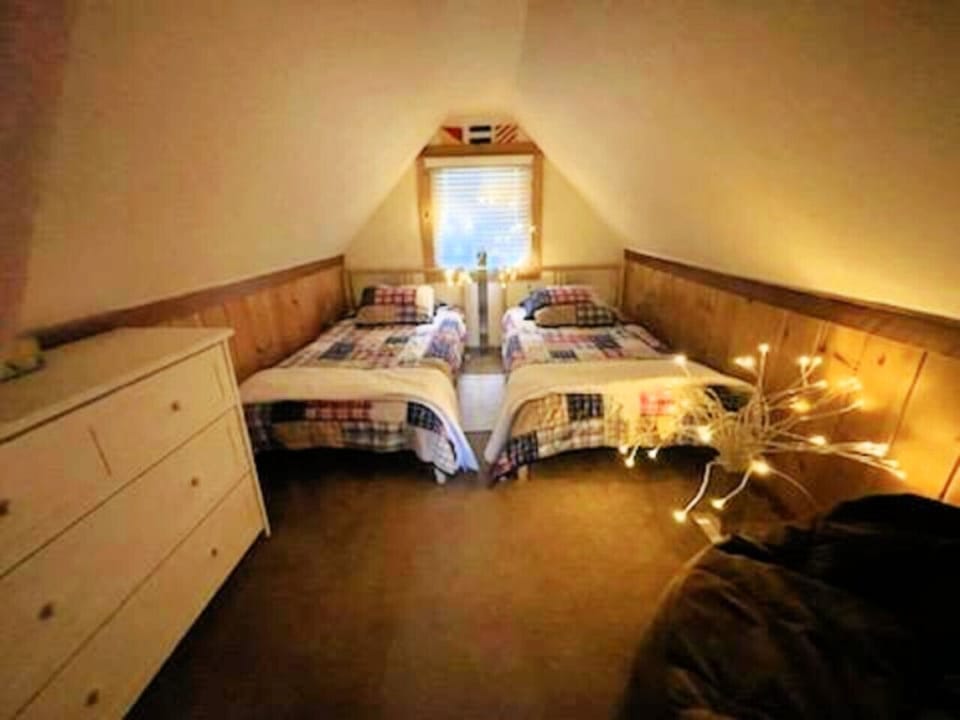Upstairs Twin please note bedrooms have curtains rather than doors.