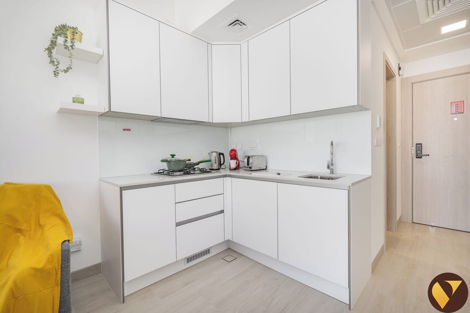Luxury Studio, City View | Private kitchen | Full-size fridge, microwave, oven, stovetop