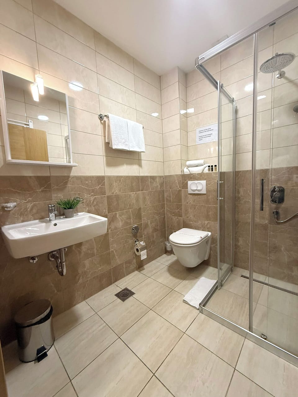 Shower, hair dryer, slippers, towels