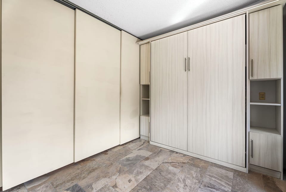 Bonus area with sliding door closing it off from the bedroom