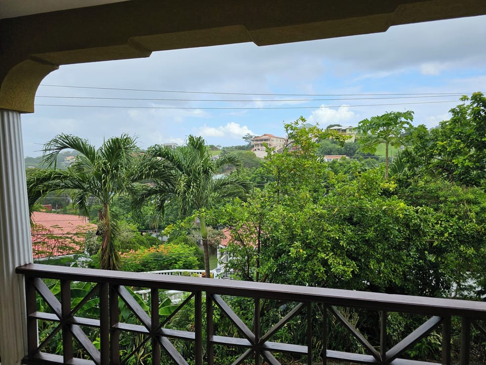 Balcony with sweeping Grenada views—perfect for coffee or sunset.