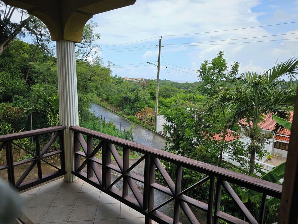 Balcony with sweeping Grenada views—perfect for coffee or sunset.
