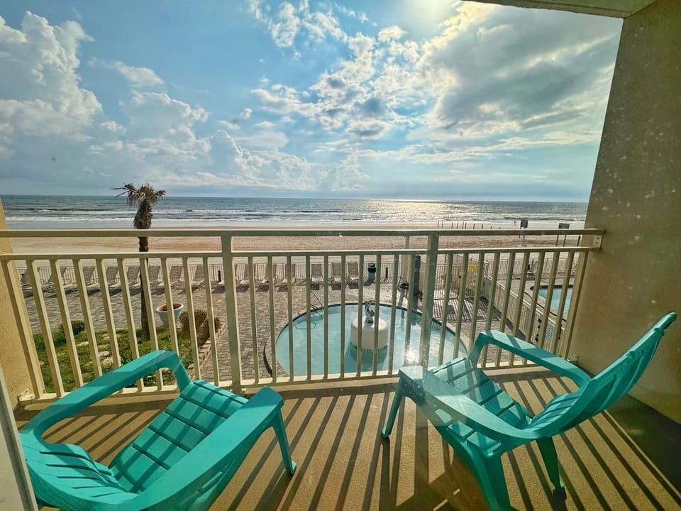 Experience tranquil living just steps away from the sandy shore.