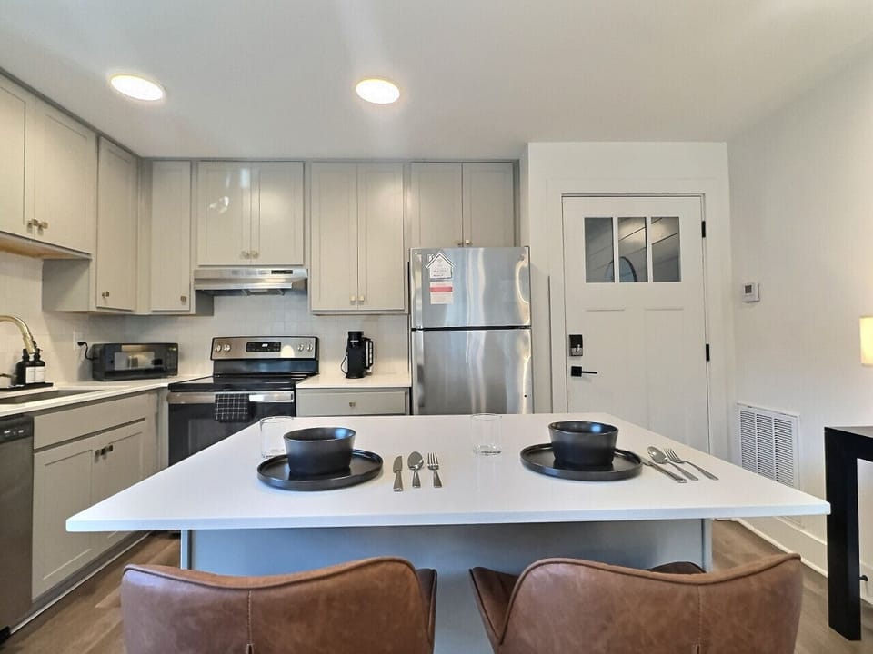 Cook, dine, and enjoy in this welcoming kitchen space, perfect for your short-term rental stay.